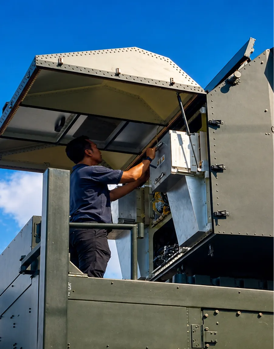 A CTB technician working on equipment